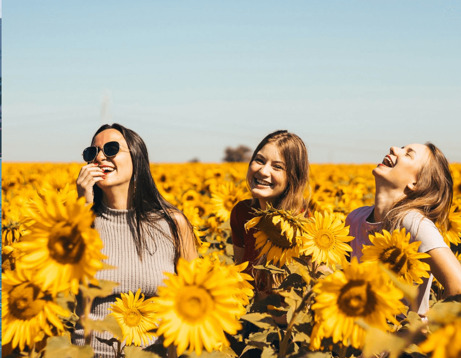 Women enjoying a sunflower field